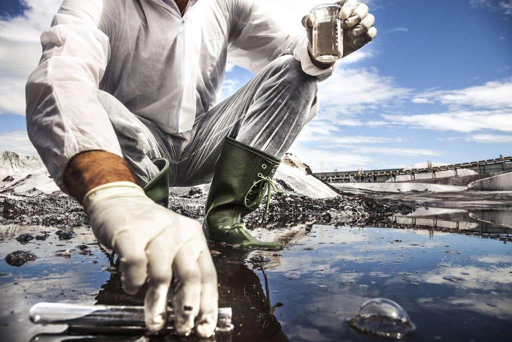 Mold Assessment Services - A Scientist analyze the water of a river | Mold Assessment Services Mold Assessment Services - A Scientist analyze the water of a river