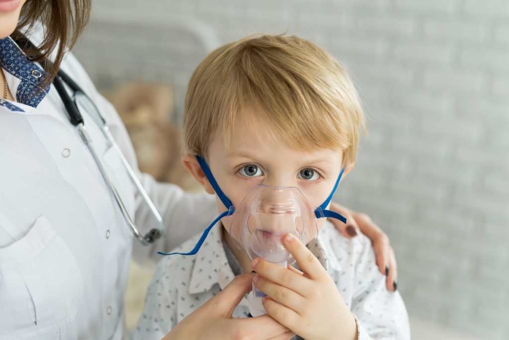 Medical doctor applying medicine inhalation treatment on a little boy with asthma inhalation therapy by the mask of inhaler.Managing asthma and mold allergies requires a comprehensive understanding of the triggers and effective strategies to minimize exposure. Asthma, a chronic inflammation of the airways, can be triggered by various allergens, with mold playing a significant role for many individuals. The distinction between atopic and nonatopic asthma emphasizes the diverse causes and necessary approaches to treatment. As asthma rates continue to rise among adults, possibly due to increased indoor air pollution, the importance of addressing mold as a significant cause of asthma becomes even more apparent.